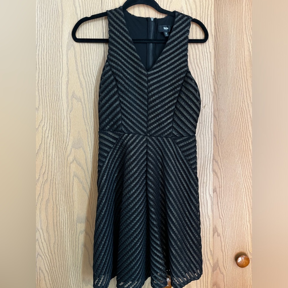 Black dress. Size small dress with gold like strips all over.